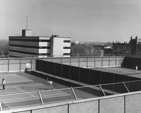 [people playing tennis on the roof of Jock Harty Arena]