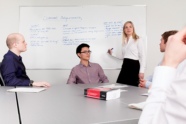 [people looking at a whiteboard]