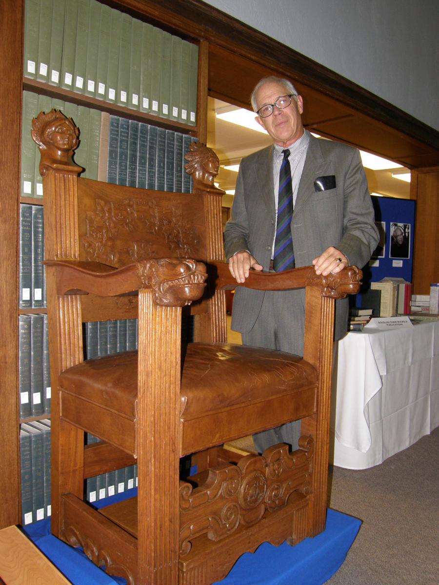 [Professor Don Akenson, a holder of the Douglas Chair in Canadian and Colonial History, stands beside the restored Douglas Chair in October 2010.]