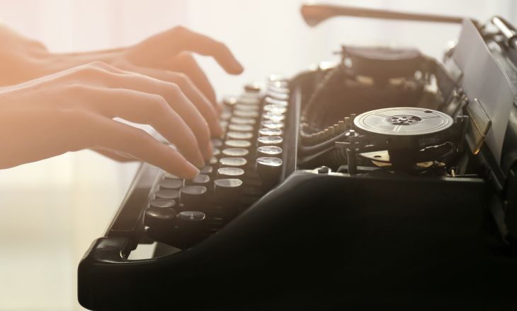 woman hands typing on a typewriter