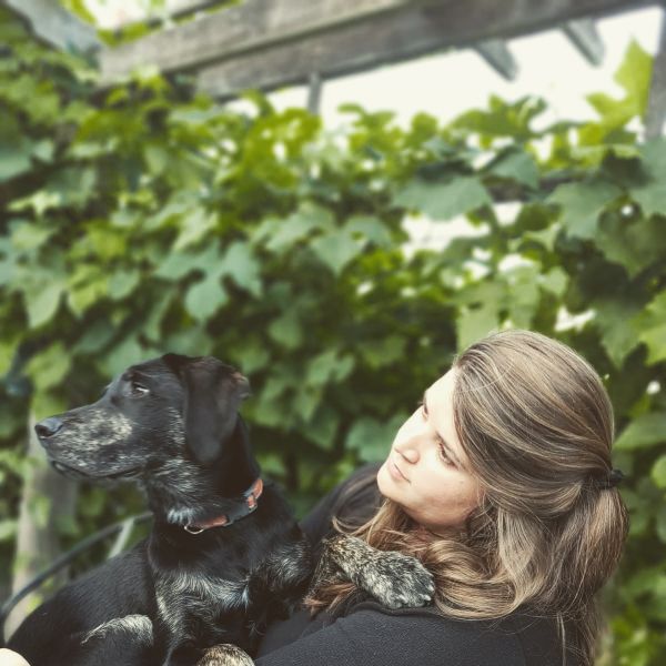 photograph of Emma Ferrett and her dog, Basil