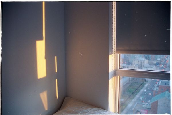Corner of a bedroom with a window