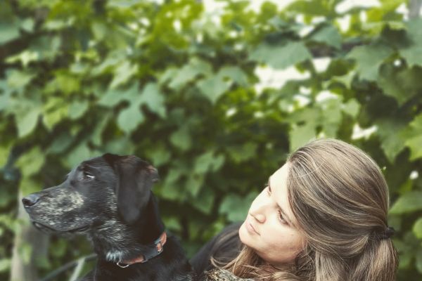 photograph of Emma Ferrett and her dog, Basil