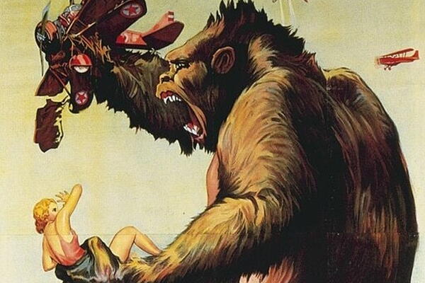 King Kong holding a smashed plane and a women