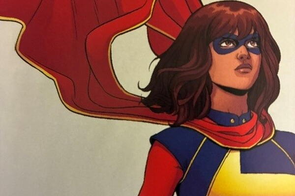 Women with dark hair in a superhero outfit