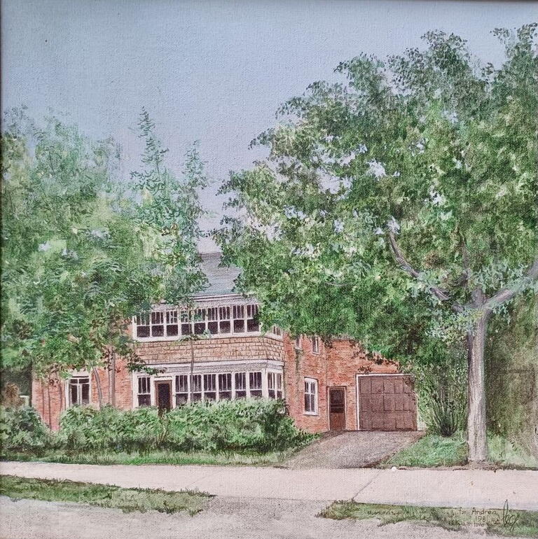 image of brick house partially covered by green trees