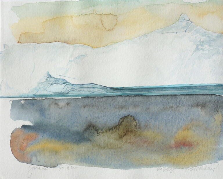 iceberg with yellow and blue sky in the background