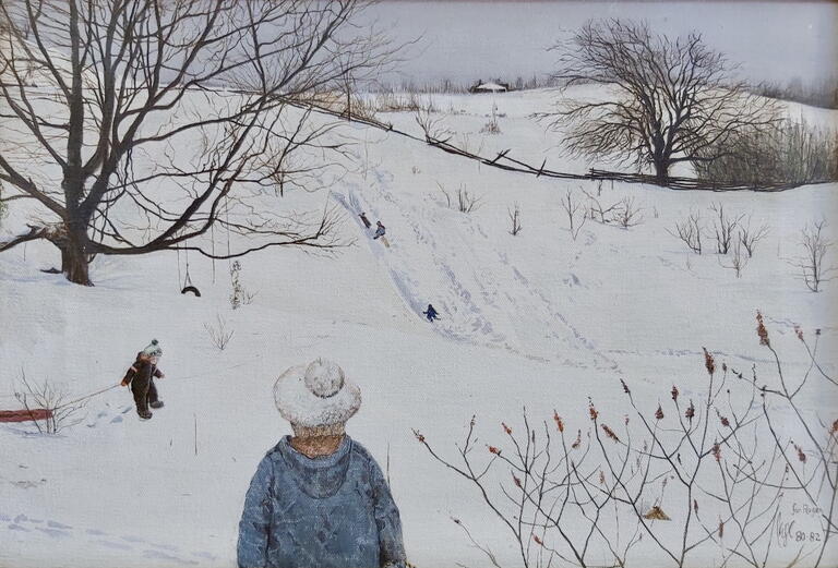 image of kids tobogganing down a snowy hill 