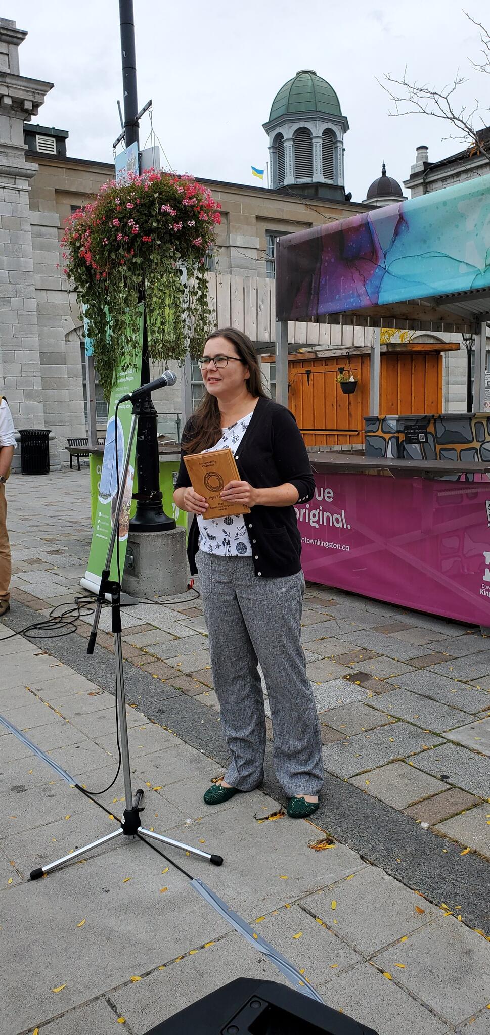 Dr. Tienhaara accepts award
