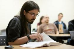 Student reading a textbook