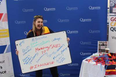 Laura Wyatt, holding an It All Adds Up Board 