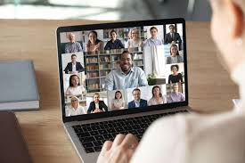 Laptop screen with multiple faces on a conference call
