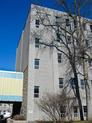 Fleming Hall, Stuart Pollock Wing; blue and yellow overpass on left.
