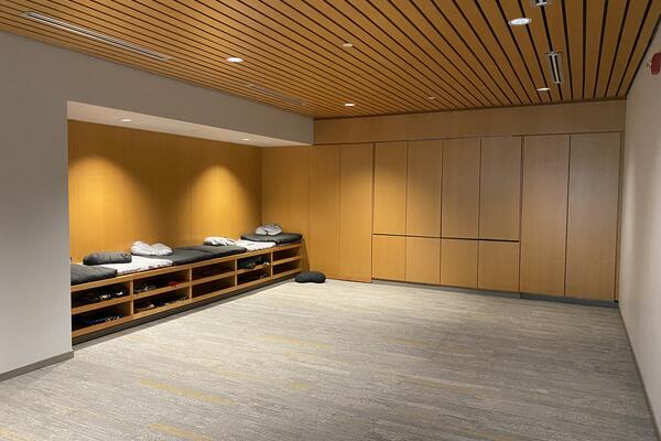 Open space with wood panel walls at the Mitchell Hall Interfaith Room. Going to campus map.