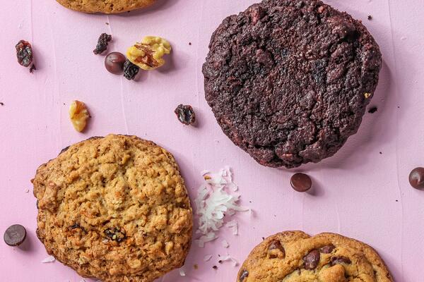 A Variety of cookies on a pink table