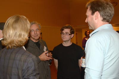 Michael MacMillan (left) talked with Clarke Mackey, current student Jared Aronoff, and Mike Craig.