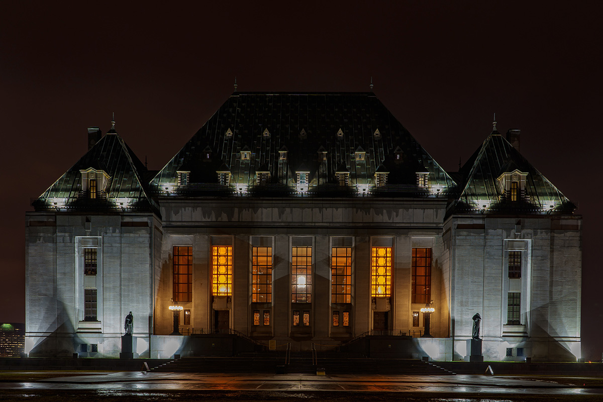Supreme Court of Canada seen at night.