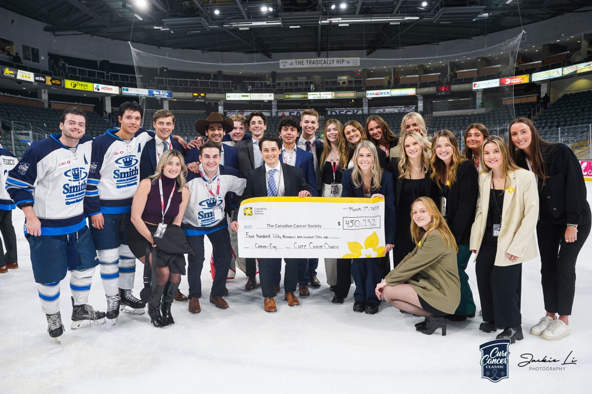 Cure Cancer Classic team celebrates after hockey game