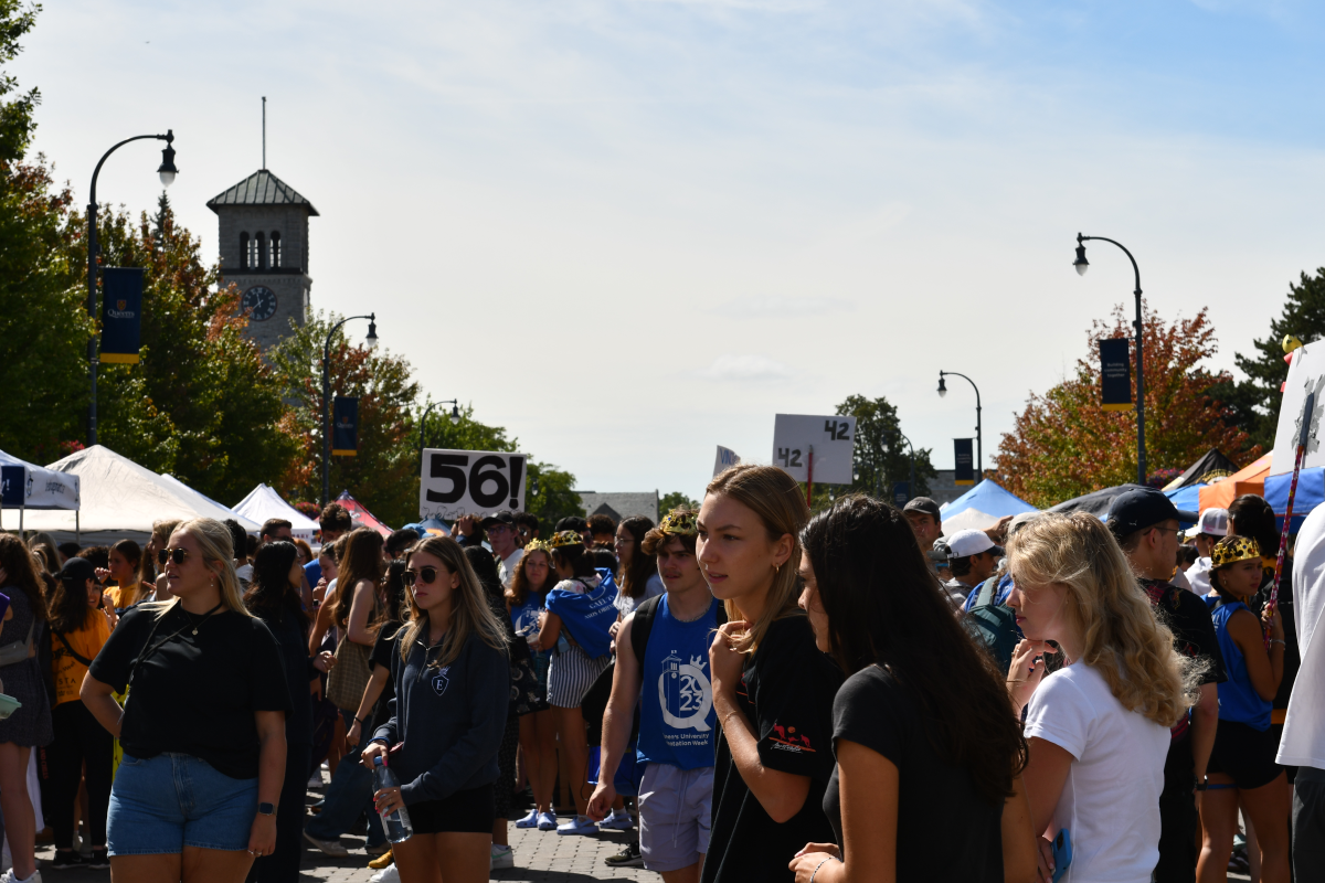 Photograph of students along University Avenue during the 2023 ASUS Sidewalk Sale.