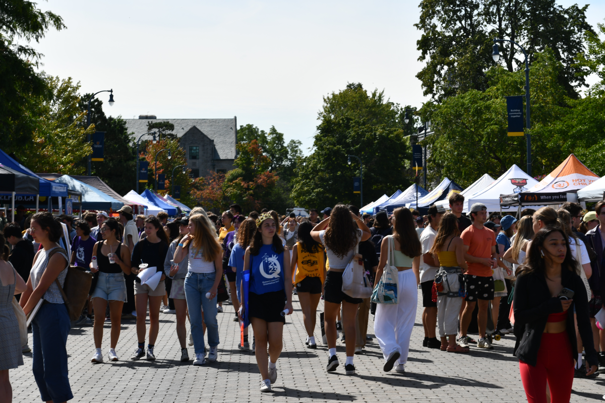 Photograph of students walking on University Avenue during ASUS Sidewalk Sale.