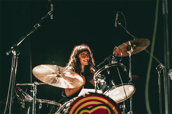 Woman playing the drums