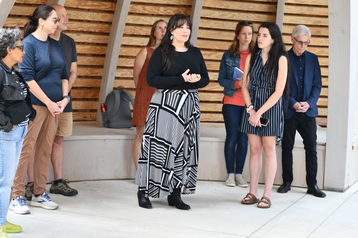 Photograph of Eladia Smoke, architect of the new space, speaking at the opening event.