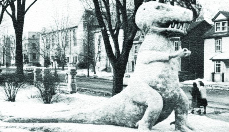 [1961  photo of a giant T-Rex snow sculpture]