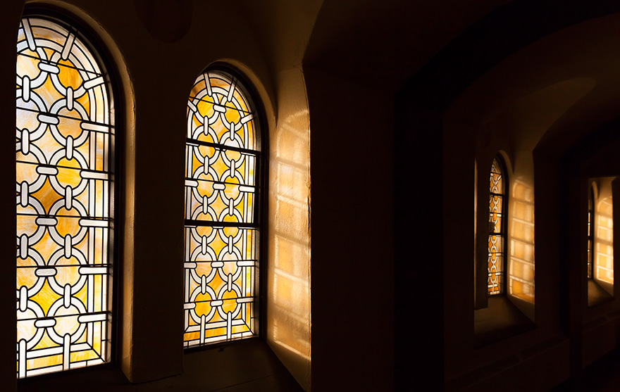 [photo of stained-glass windows in Grant Hall]