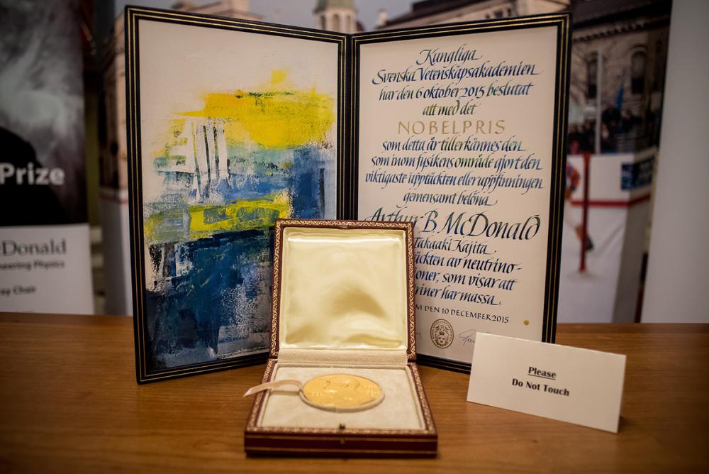 Dr. Art McDonald's Nobel medal and diploma on display during his public lecture on December 7, 2016 at Kingston City Hall. (Photo Credit: Garrett Elliott)