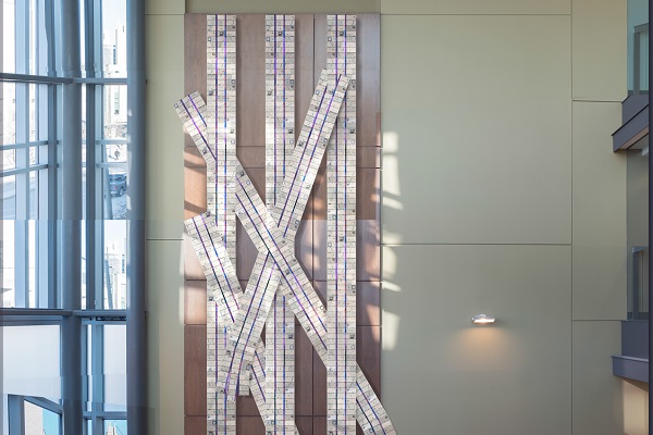 Wally Dion’s proposal is entitled “It will put your mind at ease, that we still remember these words.”  The art piece consists of three large wampum belts suspended vertically from the wall with three smaller belts woven between them. (Supplied Photo)