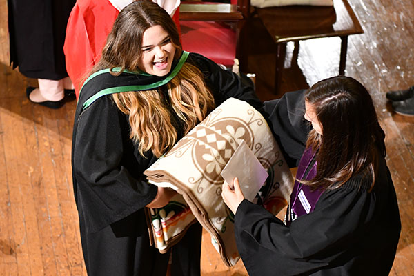 Graduate receives a Pendleton blanket