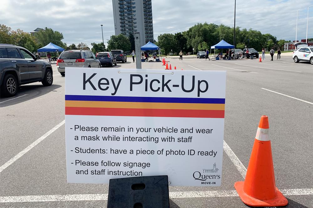 A sign displays the steps for the key pick-up process