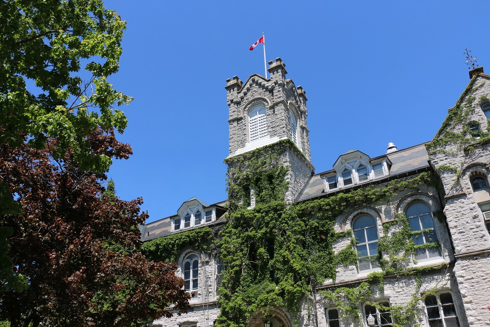 [Photo of Queen's campus in the summer]