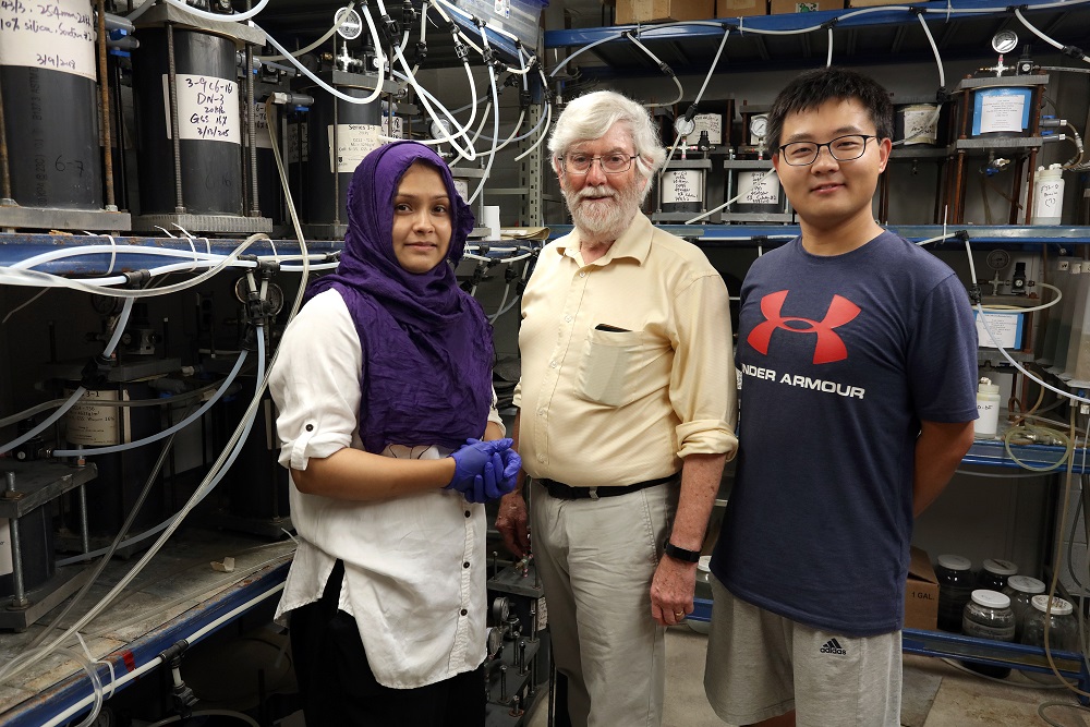 [Photo of Dr. Kerry Rowe along with graduate students Jiying Fan and Farhana Jabin in his lab in Ellis Hall.]