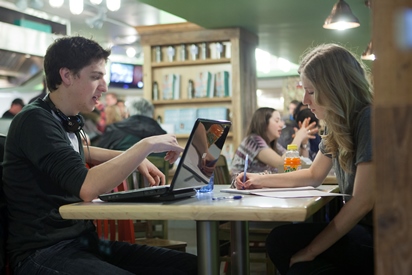 [Students working in student life space]