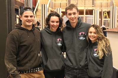 Members of the Science Formal Committee pose for a photo in front of the work in progress centerpiece of the 2018 Science Formal in Grant Hall. From left to right: Rob Purcell, Construction Chair; Claire Philips, Art Chair; Matthew Clark, Convener; and Kristen Wadey, Communications Chair. (University Communications)