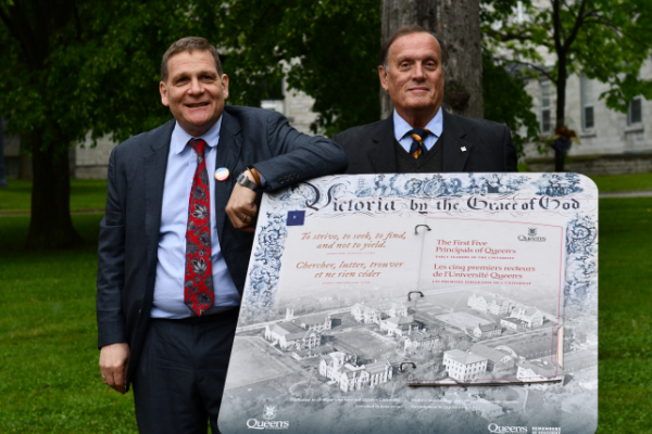 Daniel Woolf and Christopher Markwell standing with the new plinth