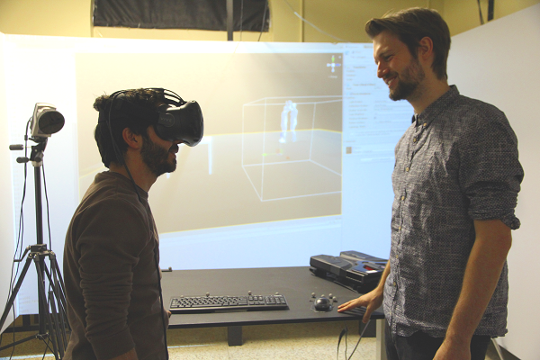 Queen's PhD candidate Sia Eftekharifar speaks with Christoph Lenk about his work in the Queen's Biomotion Lab. (University Communications)