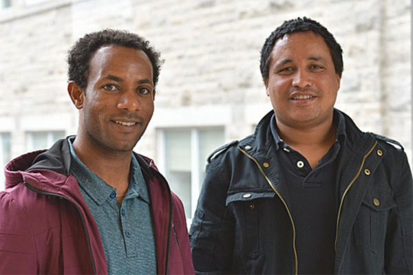 Mulugeta Chala (left) and Molalign Adugna (right), doctoral students in the School of Rehabilitation Therapy, will return to Ethiopia for a year of data collection in the fall after their first year at Queen’s. (Photo: University Communications)