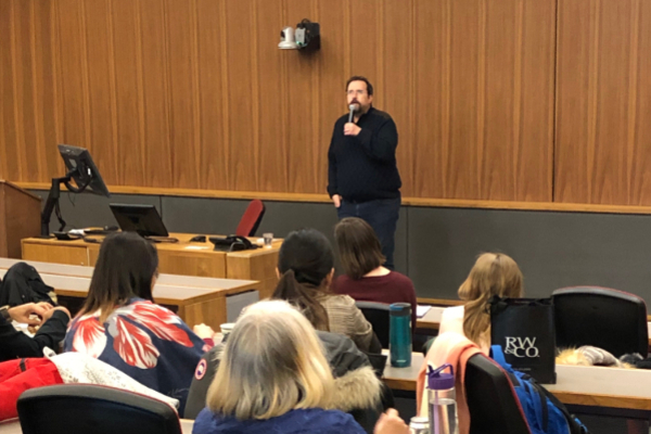 Evren Altinkas speaks to students at Queen's University.