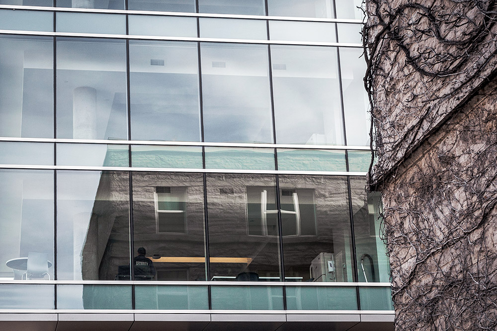 Campus security staff patrols a residence lounge.