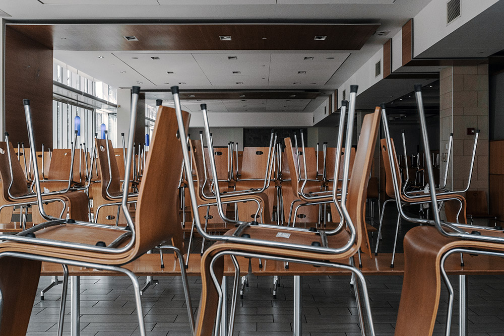 Chairs stacked for storage at a Queen's cafeteria.