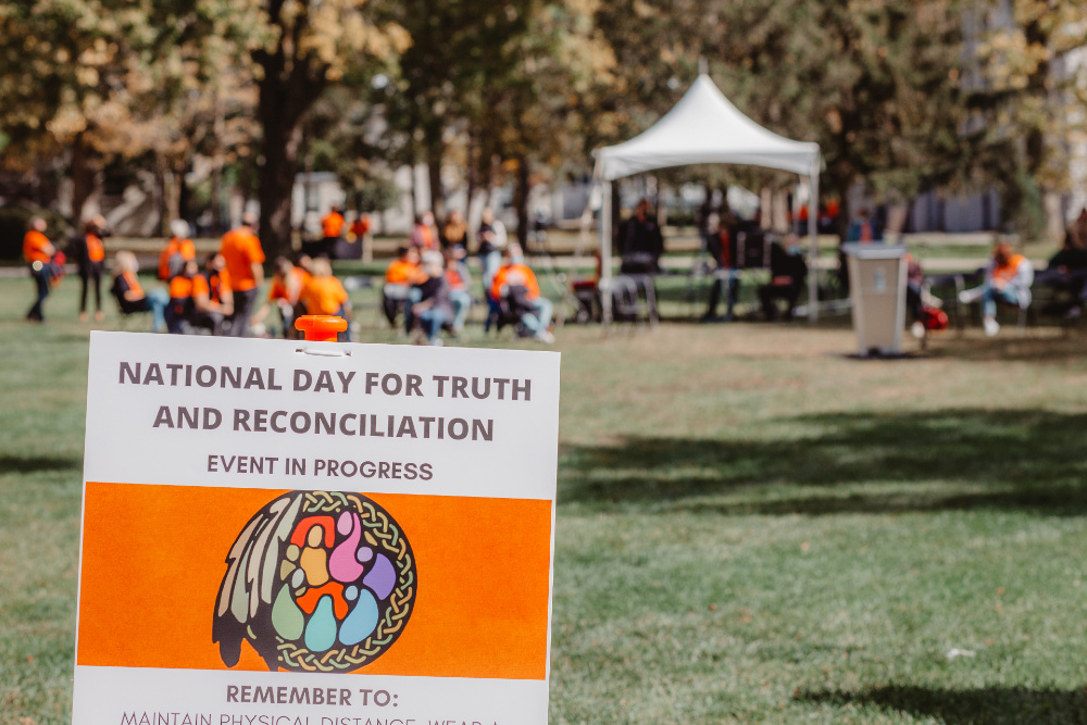 COVID-19 safety signage on site at the sacred fire.