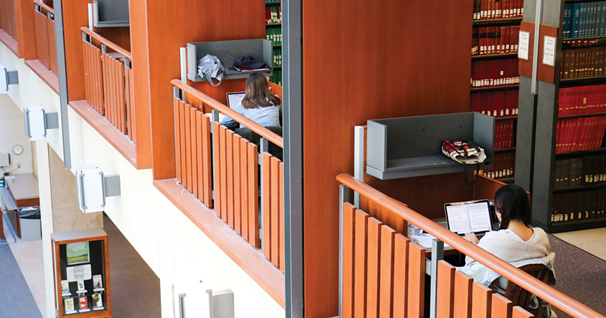Students study at a desk in Stauffer Library