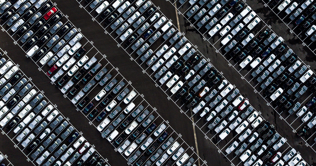 [Cars in a parking lot]