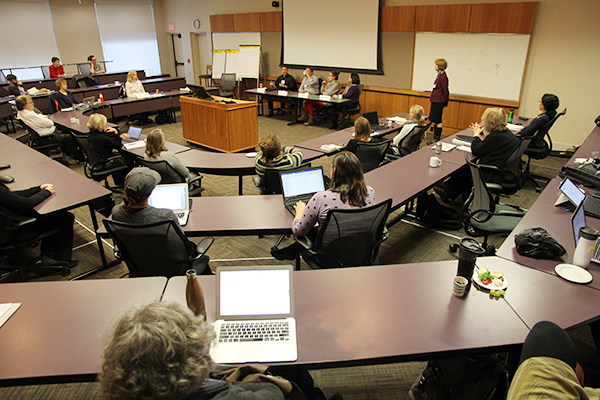 Faculty listening to panelists at Faculy Writing Retreat at the Donald Gordon Centre.