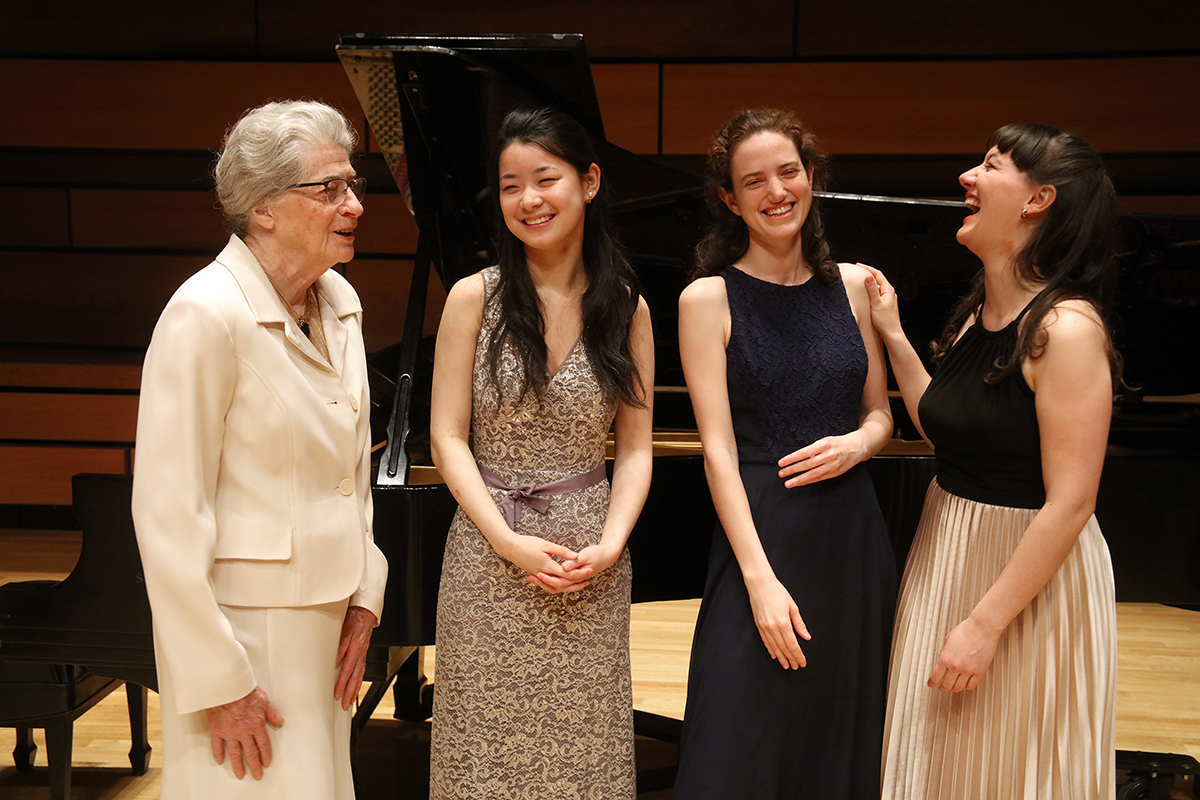 Isabel Bader speaks with the finalists of the inaugural Isabel Overton Bader Canadian Violin Competition, Lucy Wang, Katya Poplyansky, and Yolanda Bruno, at the Isabel Bader Centre for the Performing Arts.