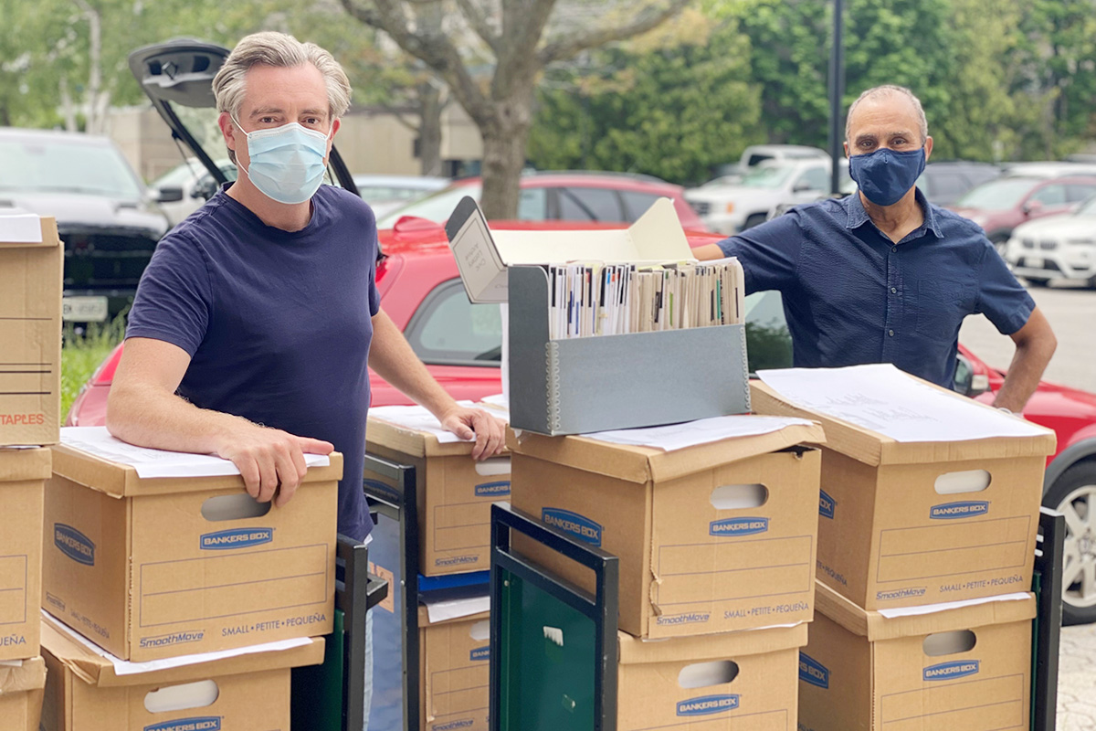 Professor Jonathan Rose receives a donation of documents from Queen's alumnus Peter MacLeod 