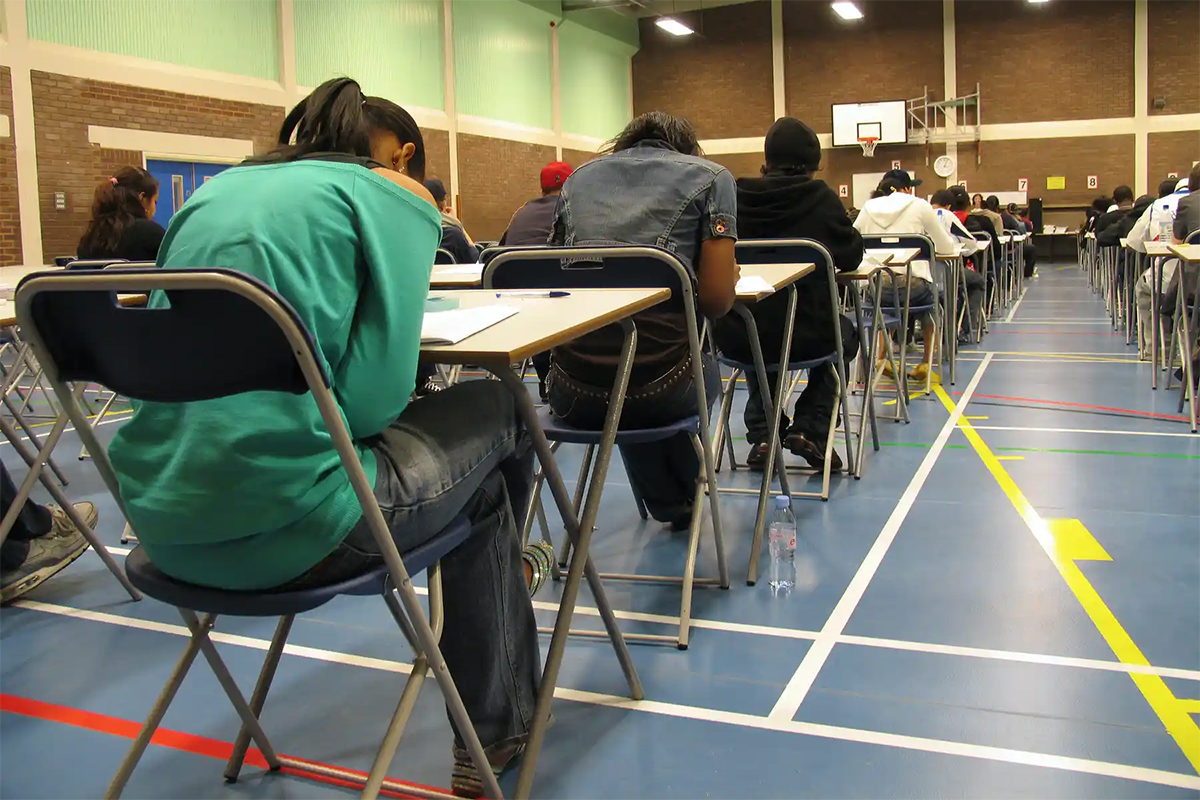 Students writing an exam.