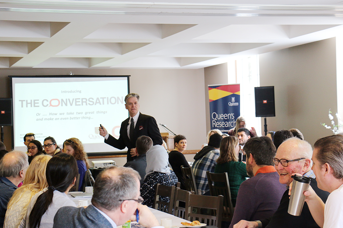 Scott White speaks to Queen's researchers about The Conversation during a workshop in 2019.